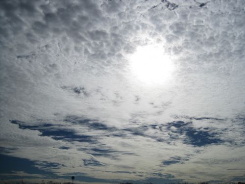 Streaky White Clouds And White Sun