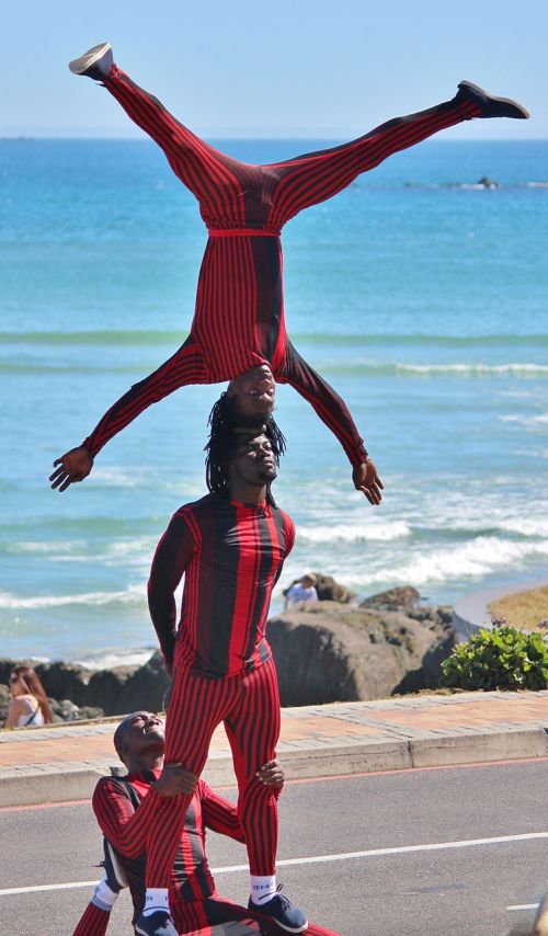 street artists acrobatics standing on your head