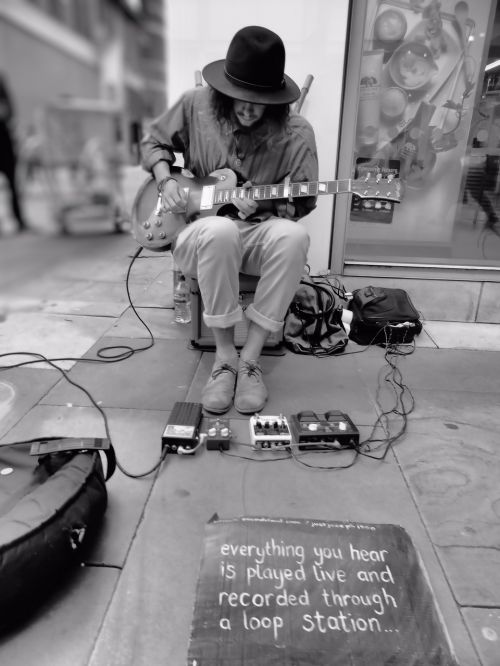 street busker musician guitar