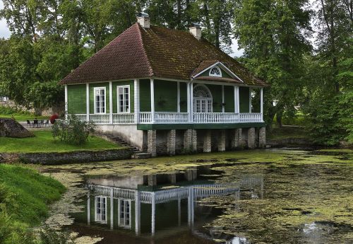 summer house mirroring lake