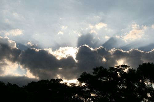 sun shining dark clouds