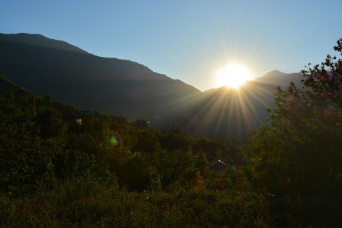 sun mountains blue sky