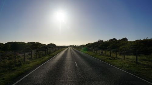 sun on road horizon perspective