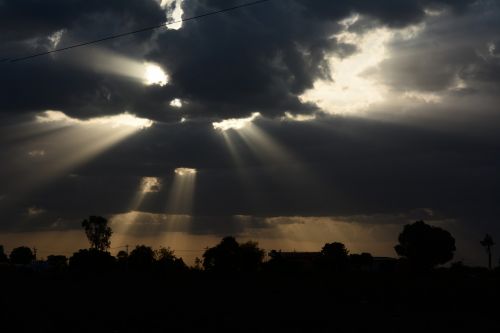 sun rays dark sky sunlight