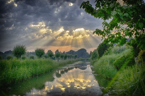 sun rays sunset storm