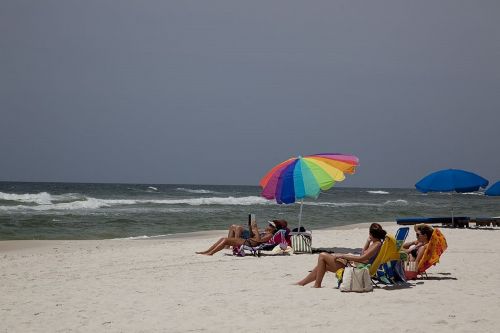 sunbathers beach sand
