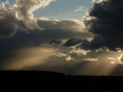 sunbeams clouds evening light