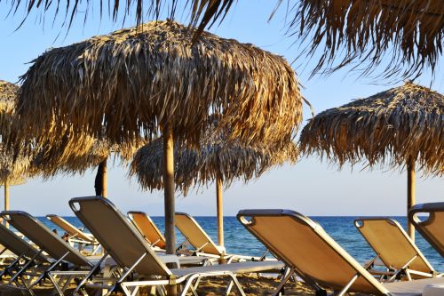 Sunbeds And Umbrellas By The Sea