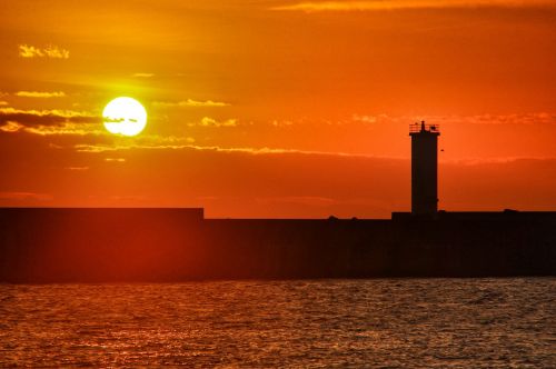 sunrise lighthouse port