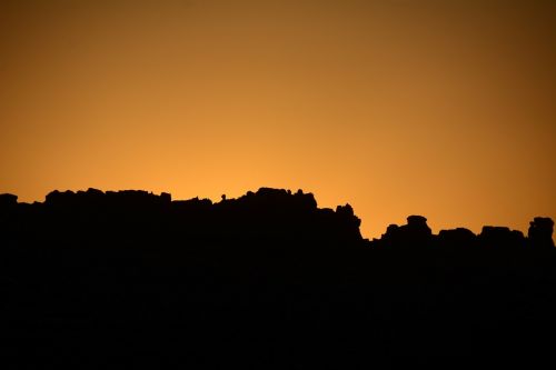 sunrise silhouette arches national park