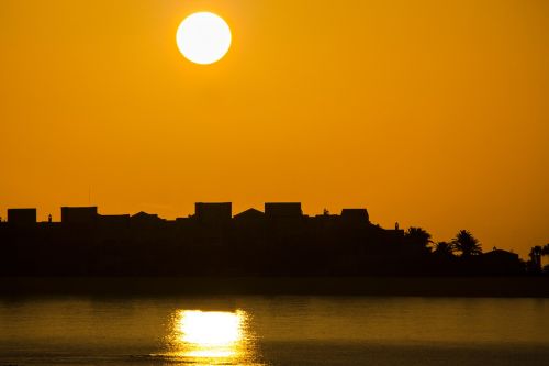 sunrise sun houses silhouette