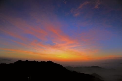 sunrise clouds four people with