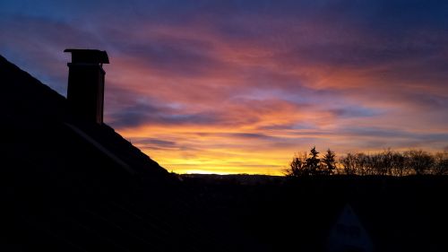 sunrise against the clock in the summer