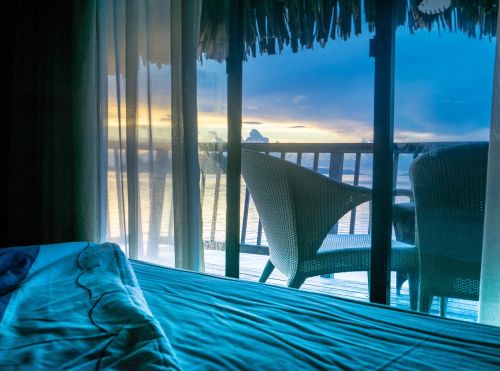 sunrise over water bungalow bora bora