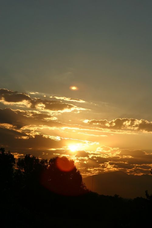 sunrise orange clouds towards the sun