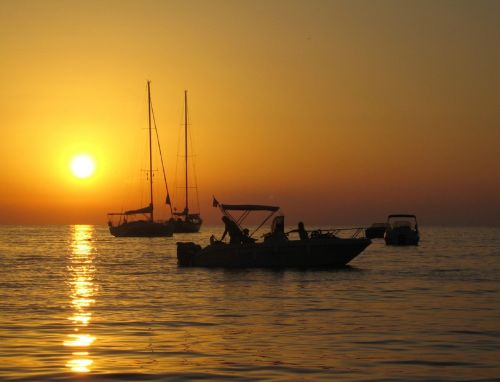 sunset ocean boats