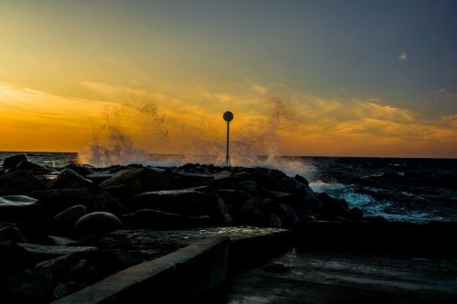 sunset spray sea
