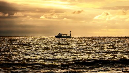 sunset boat sea