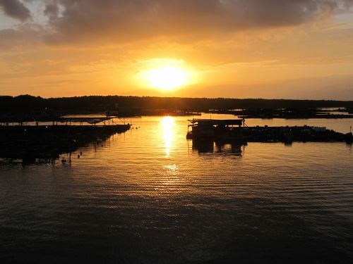 sunset fishing village sea