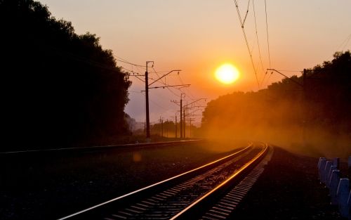 sunset railway fog