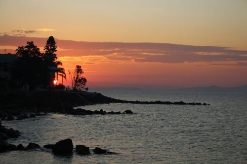 sunset silhouette shore