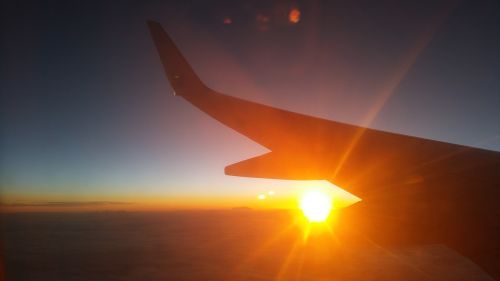 sunset clouds plane