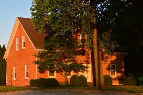 sunset farmhouse brick home