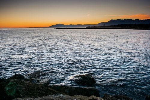 sunset sea lighthouse