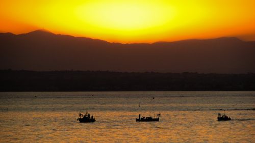 sunset sea boats