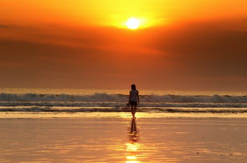 sunset woman beach