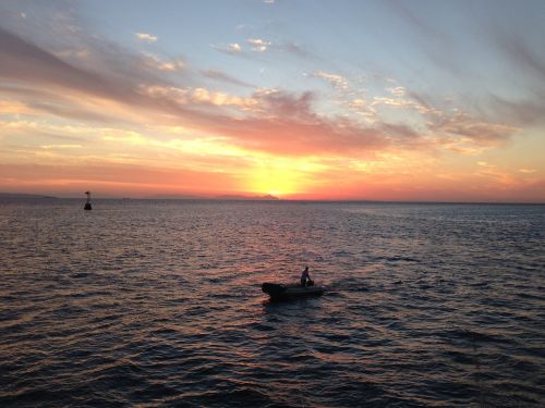 sunset red sea fisherman
