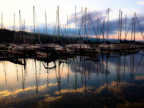 sunset sailboats lake