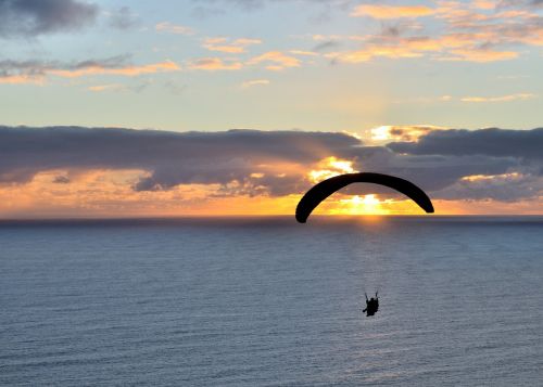 sunset paraglider ocean