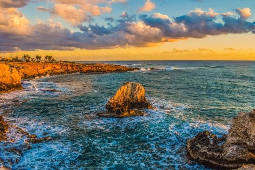 sunset rocky coast sea