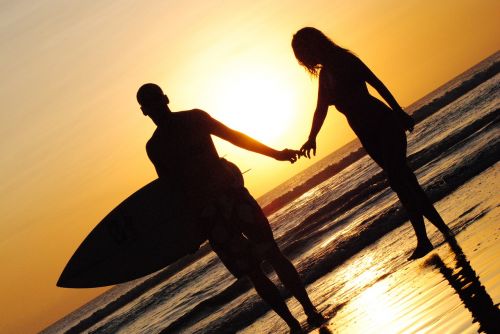 sunset beach surfing