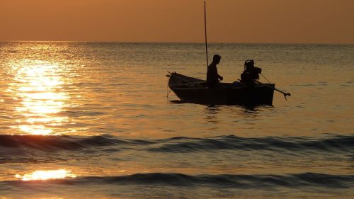 sunset fischer fishing at sunset