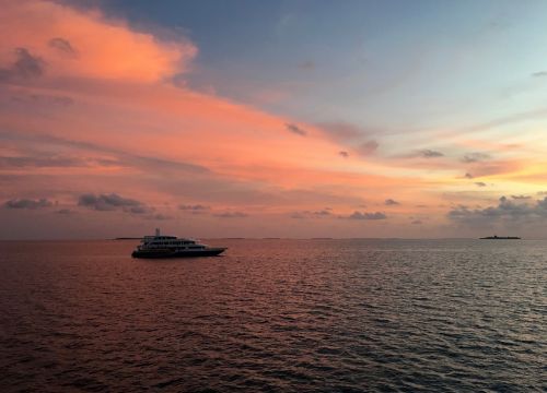 sunset the sea white cloud