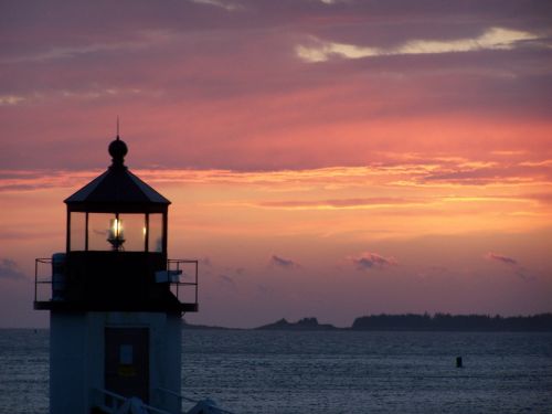 sunset water lighthouse