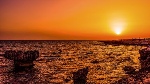 sunset sea rocky coast