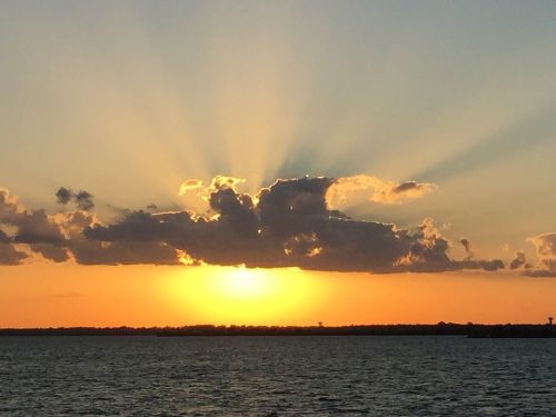 sunset water boat