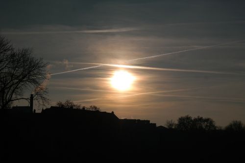 sunset contrail sun