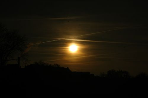 sunset contrail sun