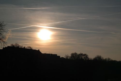 sunset contrail sun