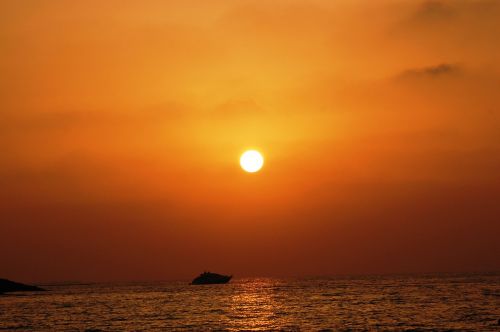 sunset ocean boat