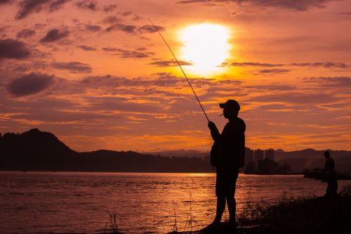 sunset fishing people silhouette