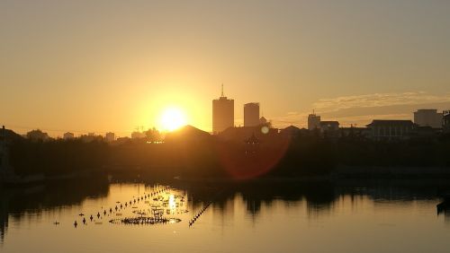 sunset riverside building