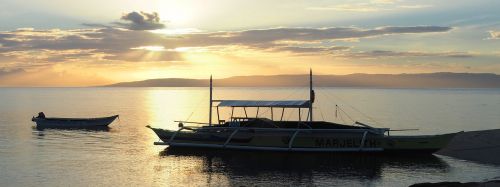 sunset boat outrigger