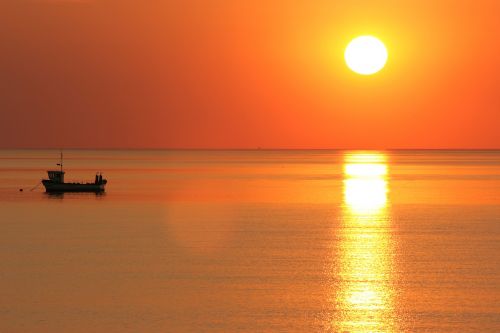 sunset sea boat