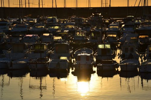 sunset pier boats