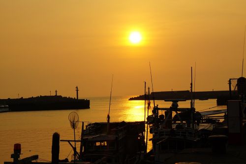 sunset boat ocean